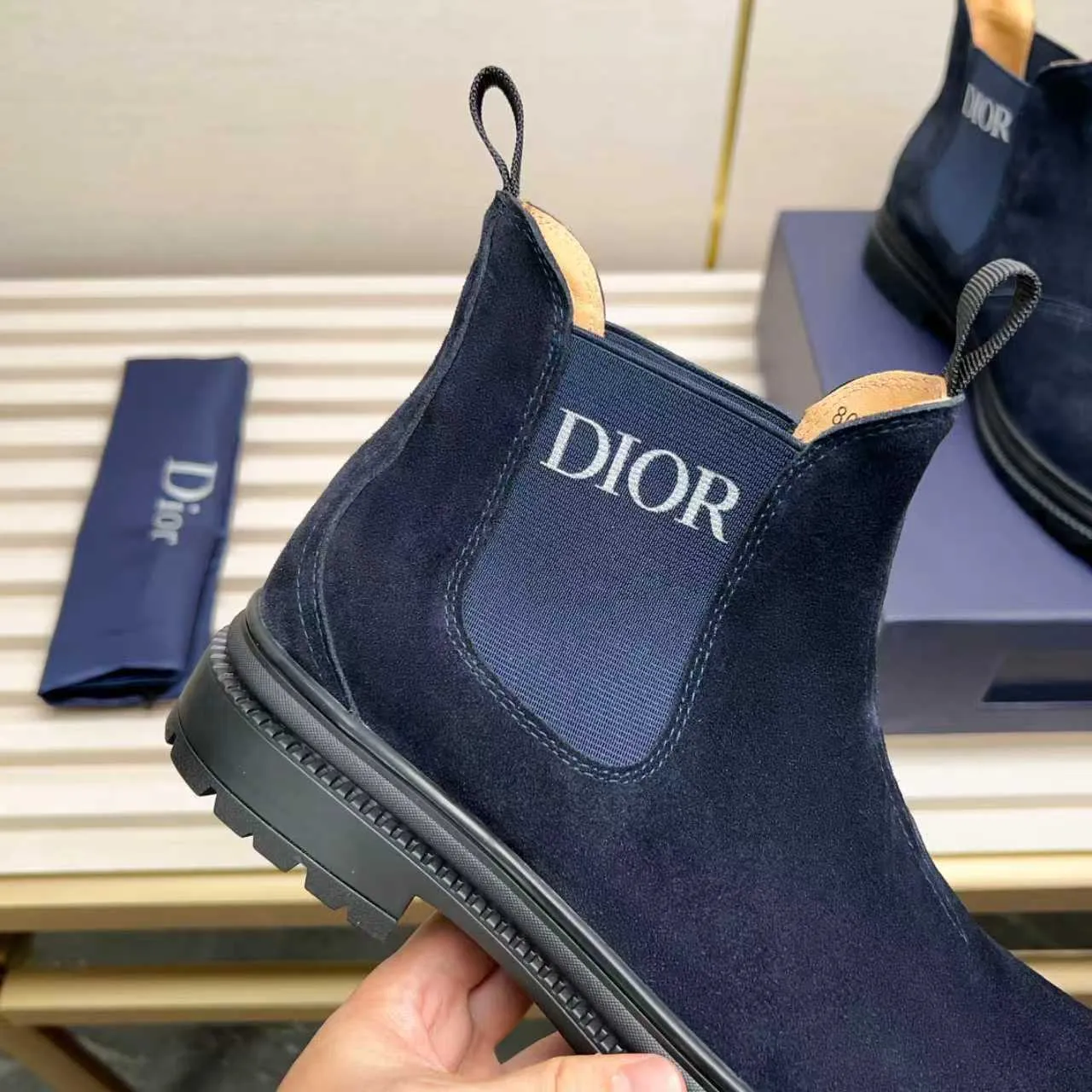 Men's Shoes 💰480 Dior A practical choice that combines protection with classic style. Made from durable Rugged Calf leather, it's tumbled and hand-finished to create a soft suede feel with a rich texture. Elastic side panels and subtle cutouts are inspired by the classic Chelsea boot. Leather upper and lining with Kummel tabs at front and rear, rubber outsole